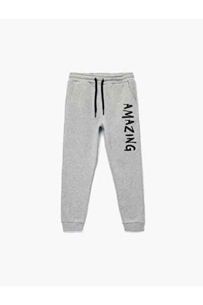 Koton Ανδρικό παντελόνι με ελαστική μέση με στάμπα σε γκρι χρώμα 6WKB40100TK