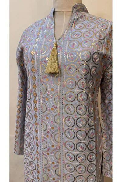 ISHRAQAT AL-AMAL A kaftan or jalabiya fully embroidered with gold circles