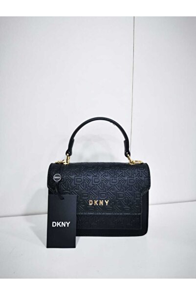 Generic A small handbag with a patterned design and top handle, a touch of luxury that complements classic looks.