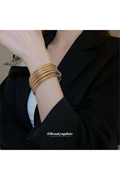 Pelin Aksesuar Gold color flexible spiral bow bracelet