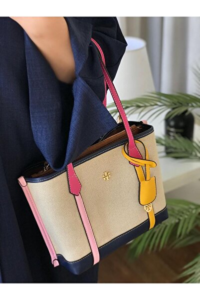 Generic A handbag made of light beige fabric, decorated with pink and yellow leather straps and dark stripes.