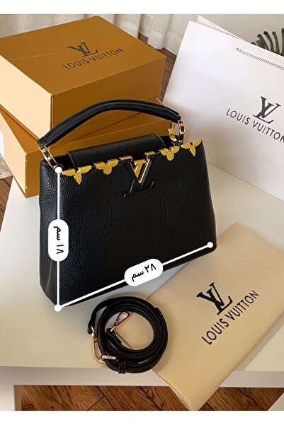Generic A black leather handbag with a luxurious gold touch, and it comes with a long, adjustable shoulder strap.
