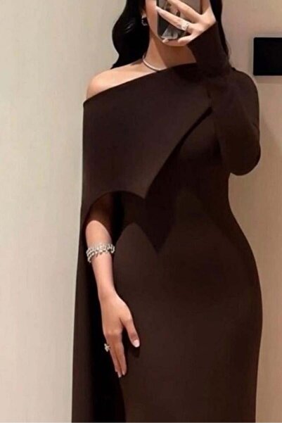 Riva Elegant brown evening dress with a distinctive design featuring a one-shoulder cut and a cascading cape layer.