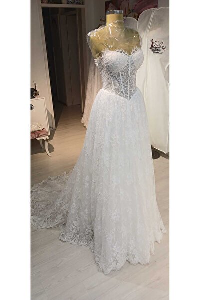 Zeliza Moda Evi فستان زفاف من الدانتيل الفرنسي بتنورة على شكل حرف A من Gepiyer