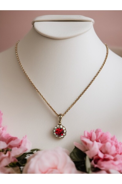 FAYRA ACCESSORIES قلادة على شكل زهرة الأقحوان مع حجر كريستال