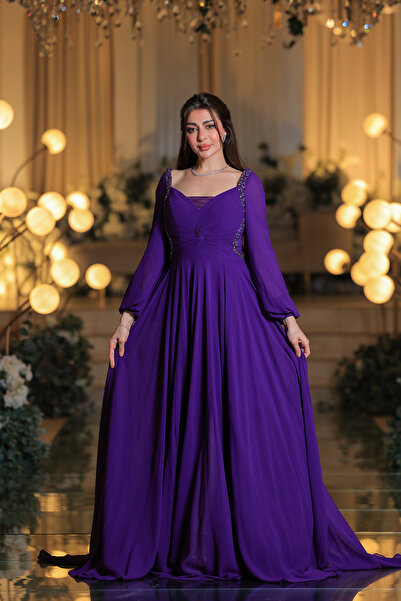 Lara A luxurious purple evening gown with crystal embroidery and regal flow.