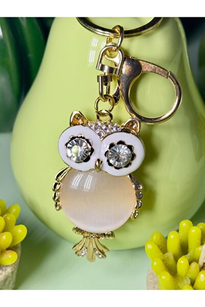 anahtarlık evreni سلسلة مفاتيح معدنية بلون بيج على شكل بومة مرصعة بالأحجار، إ...