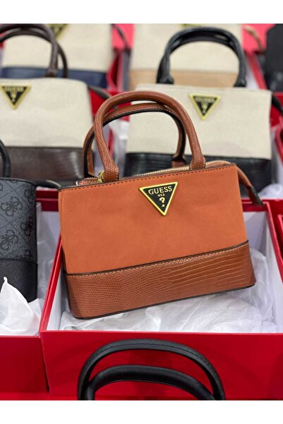 Generic A mini bag in a rich burnt orange hue with a brown crocodile-print base. A bold piece that will elevate your look.