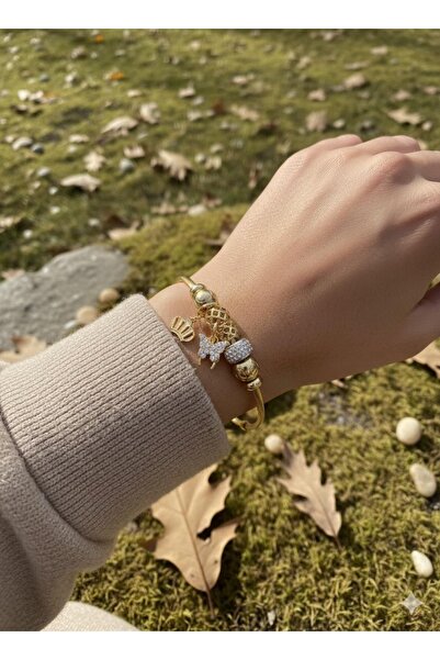 Çağla Accessories سوار من الفولاذ بلون ذهبي مع تفاصيل على شكل فراشة وشجرة الح...