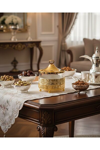 Dania Metal date-filled tray in a gold-colored glass bowl