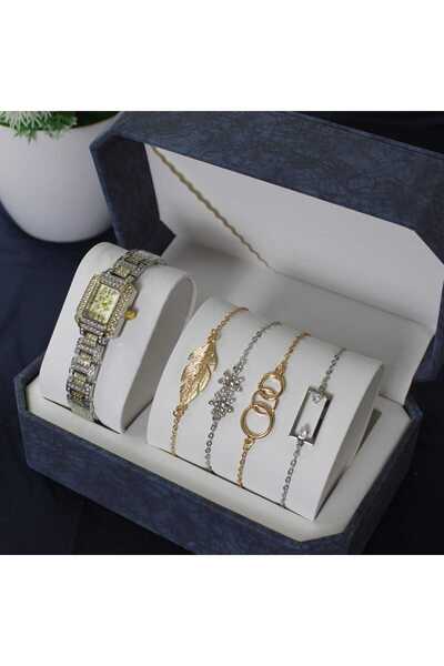 rovan Set in a blue box: a gold/silver studded wristwatch, and 4 delicate cha...