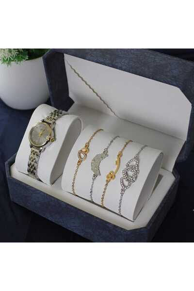 rovan A women's wristwatch with a silver and gold bracelet and four studded c...