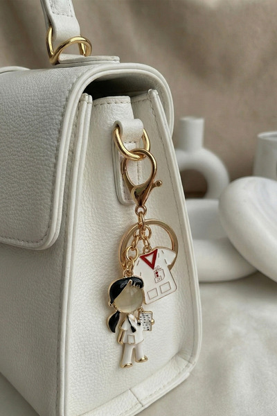 Modex Златист аксесоар за чанта на медицинска сестра с черна коса и ключодържател