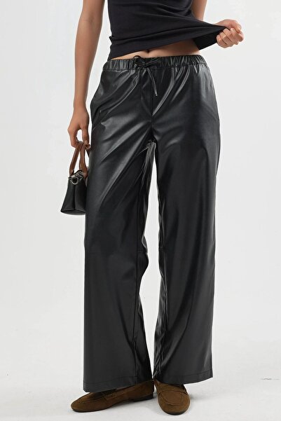 Hiccup بنطلون من الجلد الصناعي عالي الخصر برباط من BUSEM