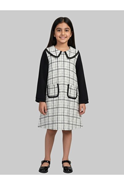 JUST FOR YOU This stylish black and white winter dress for girls features an elegant checkered pattern that adds a modern touch.
