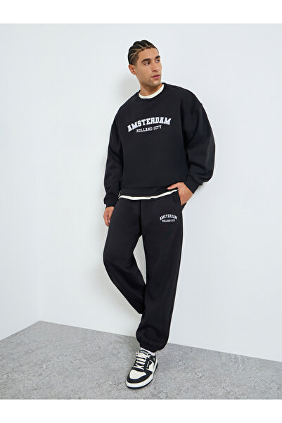 Styli Men Boxy Printed Sweatshirt and Joggers Co_Ords