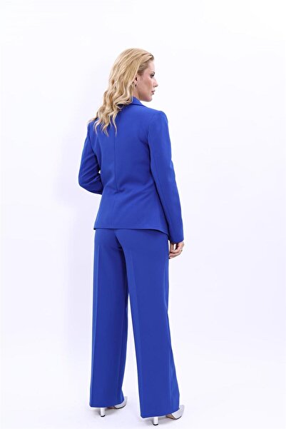 ÖNDER ÖZSOY بدلة نسائية كلاسيكية بياقة وسترة بزر واحد وبنطلون واسع الساق - أز...