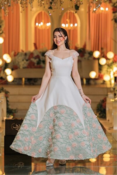 STAYILK DRESSES A cream-colored evening dress with luxurious pink embroidery and off-the-shoulder design.