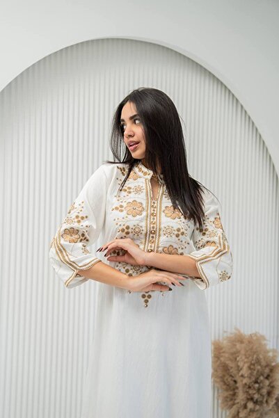 AFandina A sophisticated jalabiya with luxurious embroidery for an elegant an...