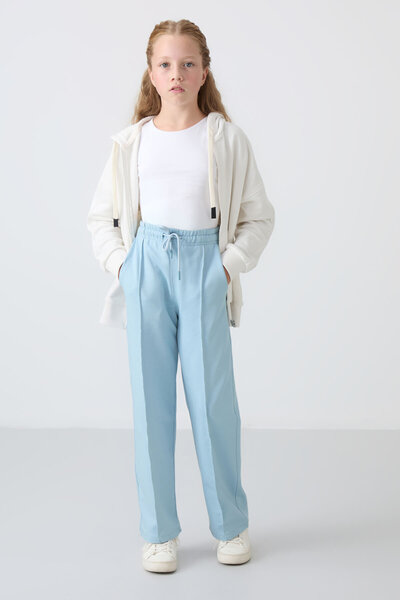 TOMMY LIFE Açık Mavi Cepli Ön Dikiş Detaylı Geniş Paça Kız Çocuk Eşofman Altı...