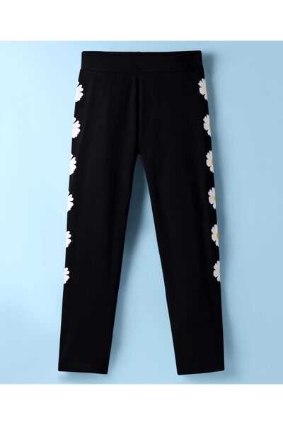 Pine kids بنطال ضيق طويل من القطن المحبوك بنقشة زهور - أسود