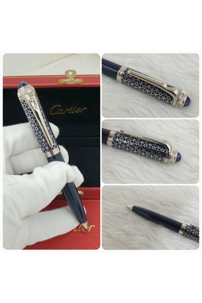 Pen A navy blue pen with top-patterned designs, along with its accessories: a red bag and gift box.