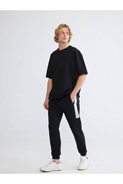 LC Waikiki Ανδρικό παντελόνι Jogger XSIDES Black Standard Fit