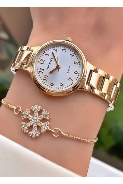 Tom Jones ساعة يد نسائية ذات علامة تجارية بلون ذهبي مع سوار فولاذي - علبة فول...