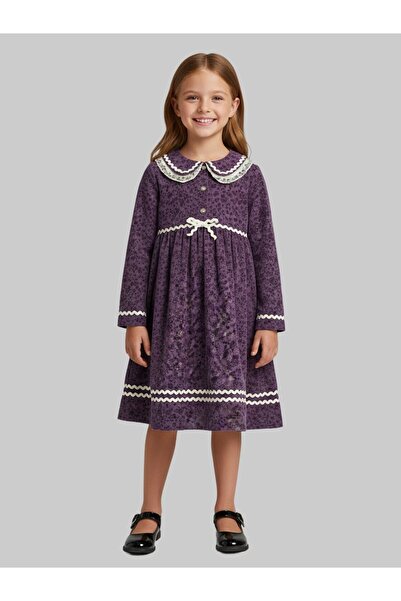 kinzi fashion فستان بناتي بلون بنفسجي رائع يتميز بقصته الجذابة التي تضفي لمسة من السحر على إطلالة الفتاة الصغيرة