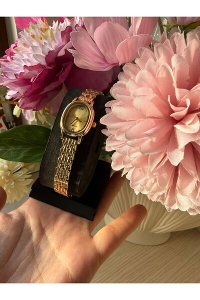 rubsey ساعة يد نسائية كلاسيكية بتصميم معدني بسيط مع حزام داخلي أصفر