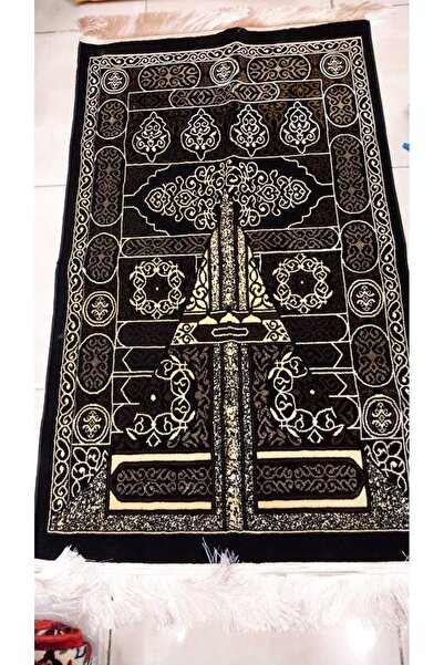 FABRIC A black and gold heritage-style rug with intense patterns, measuring 7...