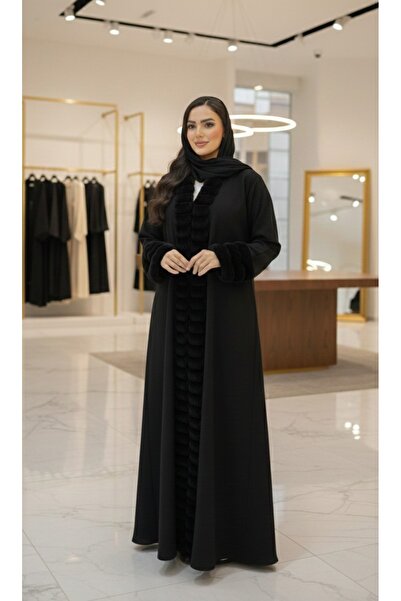 Nasa A winter abaya designed from winter fabric, with thick black fur on the sleeves and hem.