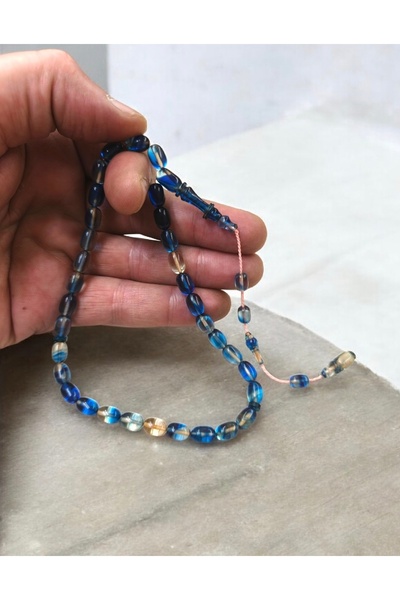 İnan Tesbih سبحة من العنبر الناري مصنوعة يدويًا بواسطة صلاح أستا، بتصميم حلقي بلون خاص