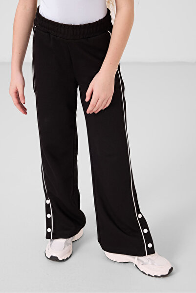 TOMMY LIFE Μαύρο παντελόνι Palazzo για κορίτσια με φαρδύ πόδι με λεπτομέρεια ...