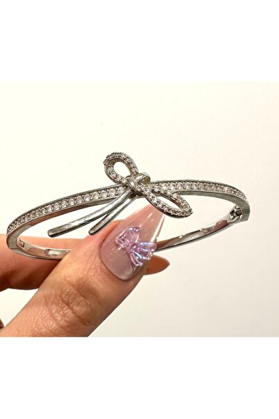 GLOW ACCESSORIES BAE سوار فاخر من الزركون والفولاذ على شكل فيونكة