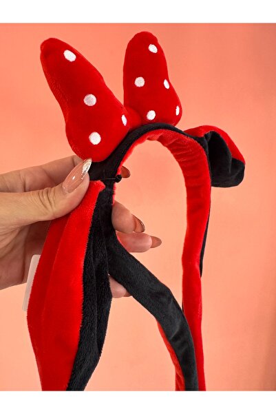 La She Accessories Red and black polka dot mechanism headphones.