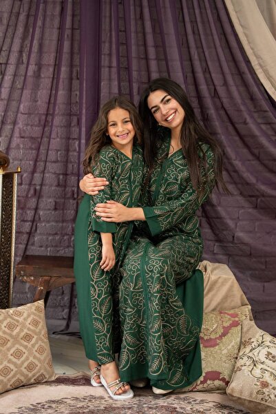 AFandina This mother and daughter jalabiya features delicate embroidery and a...