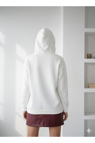 ribana Women's three-thread soft touch long sleeve sweatshirt with pocket detail, drawstring tie, and embroidered bow accent.