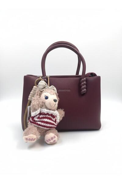 loraina A trendy women's handbag - a "tote" design in soft leather with a cute teddy bear accessory.