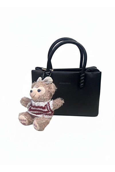 loraina A trendy women's handbag - a "tote" design in soft leather with a cute teddy bear accessory.
