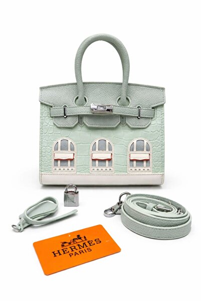 Genevcorner A luxurious handbag in an elegant mint green color, made of premium leather with a raised pattern.