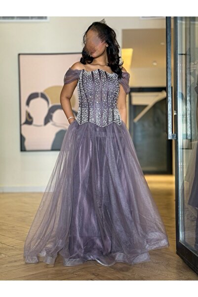 Generic A royal purple evening dress with an elegant design, embellished with crystals.