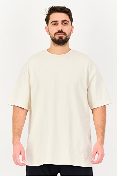 Puma تيشيرت رياضي رجالي من إكس سيلكت، بأكمام قصيرة، لون بيج.