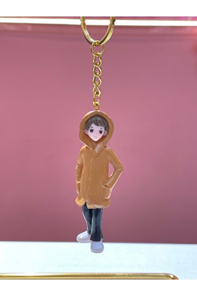 La She Accessories Keychain with a male figure