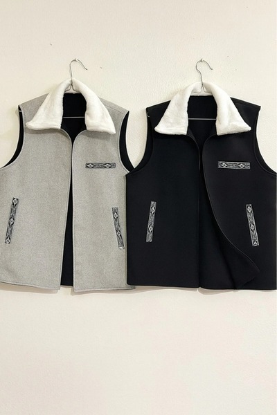 aram A double-faced winter vest with a distinctive design to give you elegance. High-quality fabric with a fur collar in a traditional Sadu style.