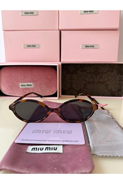 Sunglasses Women's sunglasses, tiger print frame and black lenses. Includes case, cleaning cloth, card, and pink fabric pouch.