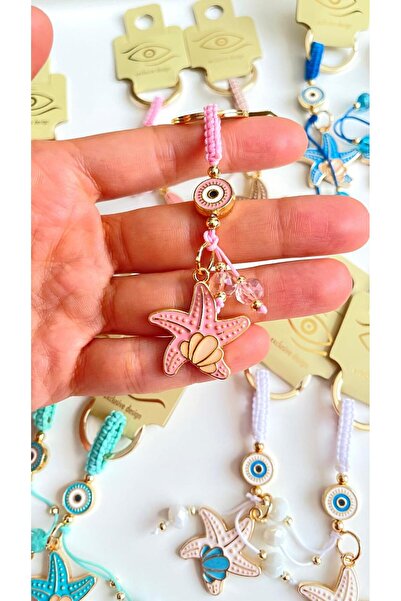 Cassime Breloc cu ochi de stea de mare roz placat cu aur