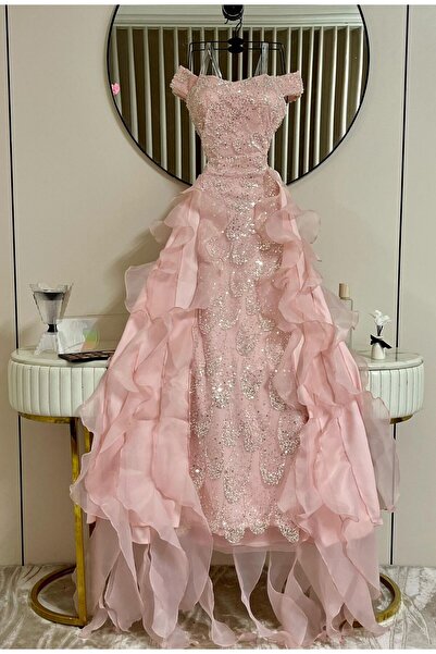 LAMSAT LATIN A pink evening dress embroidered with sparkling crystals and featuring a ruffled design.