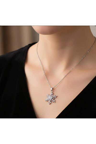 stainless steell قلادة موديل دوارة بتصميم ندفة الثلج فضية اللون