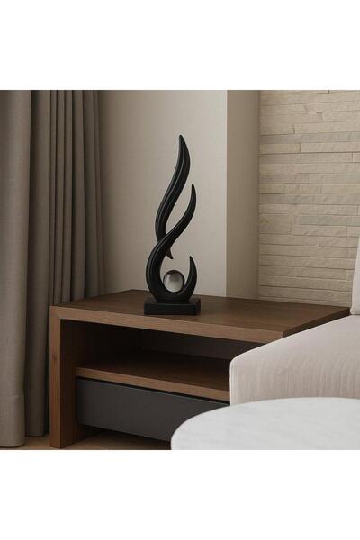 Oss elhetraf A sleek, decorative fiber sculpture, 27 cm tall, in black.